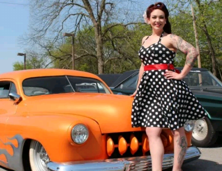 Beautiful women with orange car