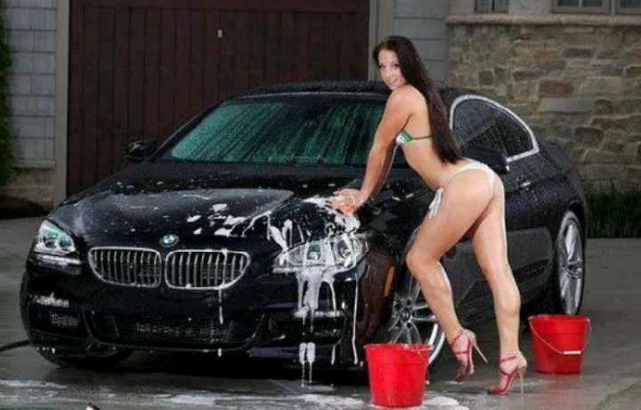 Model girl washing car